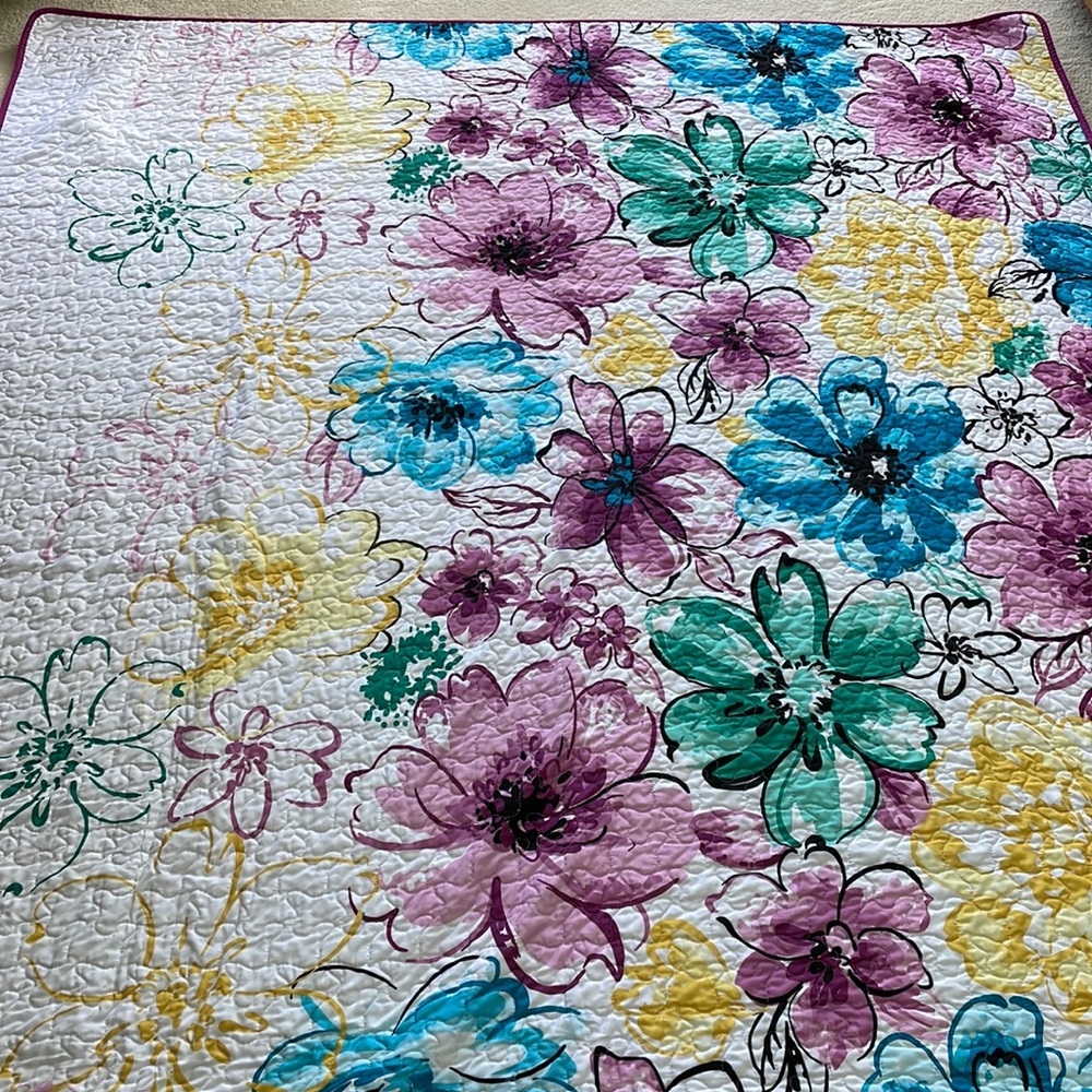 Purple, blue, yellow quilt and matching sham. Like new. Twin size.
